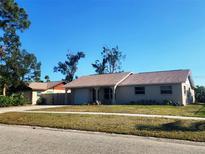 Charming single-story home with a well-maintained lawn and attached garage at 4058 Gatewood Dr, Sarasota, FL 34232