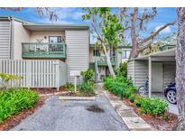 Inviting condo with lush landscaping, covered parking, and private entrances at 1532 Pelican Point Dr # 240, Sarasota, FL 34231