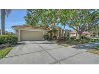 Attractive single-story home boasts a well-manicured lawn, mature landscaping, and inviting curb appeal at 241 Willow Bend Way, Osprey, FL 34229