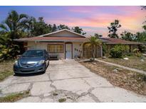 Charming single-story home featuring a spacious driveway and well-maintained front yard with mature trees at 2417 6Th Avenue E Dr, Bradenton, FL 34208