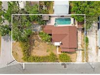 An aerial view showcases this cozy home and its private backyard pool with a spa, creating a perfect outdoor retreat at 316 29Th W St, Bradenton, FL 34205