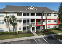 Inviting condo building with screened patios, lush landscaping, and ample parking at 4802 51St W St # 704, Bradenton, FL 34210