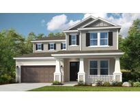Charming two-story home featuring a covered porch, gray siding, black shutters and a two car garage at 7052 Foxboro Way, Nokomis, FL 34275