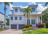 Stunning two-story home with a meticulously landscaped front yard and a two-car garage at 7142 Hawks Harbor Cir, Bradenton, FL 34207