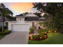 Charming single-Gathering home with a well-manicured lawn and inviting curb appeal at 5023 Brickell Park Cv, Bradenton, FL 34211