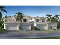 Charming townhouse with a two-car garage, complemented by lush landscaping and a well-manicured lawn at 5632 Summit Pointe Cir # 101, Bradenton, FL 34210