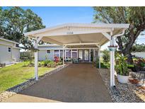 Charming home featuring a covered carport, well-maintained landscaping and inviting curb appeal at 3333 26Th E Ave # 1004, Bradenton, FL 34208