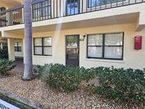 Charming condo unit with private entrance, unit number 104, and well-maintained landscaping at 425 30Th W Ave # C104, Bradenton, FL 34205