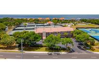 Waterfront condos with tennis courts, lush landscaping, and community feel, perfect for relaxed coastal living at 4510 El Conquistador Pkwy # 105, Bradenton, FL 34210