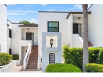 Inviting condo complex with multiple units, well-maintained landscaping, and a clear directory for easy navigation at 5014 Marshfield Rd # 30, Sarasota, FL 34235