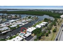 Waterfront property with a pool and dock located on a canal leading to open water at 10415 Waterbird Way # 10415, Bradenton, FL 34209
