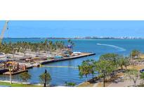 Scenic waterfront view overlooking a construction project on the water and Tampa skyline at 1064 N Tamiami Trl # 1611, Sarasota, FL 34236