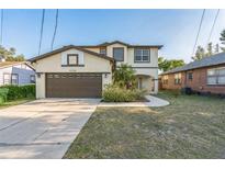 Charming two-story home featuring a two-car garage, landscaped yard, and neutral exterior paint scheme at 1330 16Th St, Sarasota, FL 34236