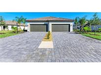 New construction home with two-car garage and long driveway at 15507 Sunny Day Dr, Bradenton, FL 34211