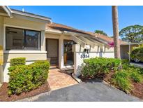 Charming villa featuring well-maintained landscaping and a welcoming front entrance at 5354 Myrtle Wood # 50, Sarasota, FL 34235