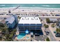 Stunning aerial view of beach condo with private pool, hot tub, and gulf views at 901 Gulf S Dr # 3, Bradenton Beach, FL 34217
