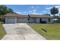 Charming single story home featuring an attached two car garage and well maintained lawn at 2716 81St E Ave, Ellenton, FL 34222