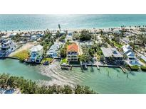 Stunning aerial view of a waterfront property with private boat dock and ocean access to the gulf at 416 Casey Key Rd, Nokomis, FL 34275