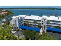 Waterfront condo complex boasts covered parking, balconies, and stunning water views at 615 Dream Island Pl # 303, Longboat Key, FL 34228