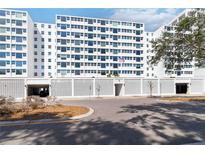 Contemporary condominium building with decorative concrete fencing and covered parking at 33 S Gulfstream Ave # 905, Sarasota, FL 34236