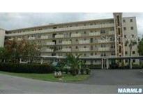 Condominium building featuring multiple stories and well-maintained landscaping at 3620 Ironwood Cir # 506-O, Bradenton, FL 34209