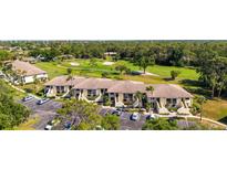 Golf community condos feature lovely landscaping, neutral exteriors, and convenient parking at 4580 Longwater # 61, Sarasota, FL 34235
