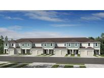 New townhome construction featuring a row of homes and individual garages at 5901 Biscotti St, Nokomis, FL 34275