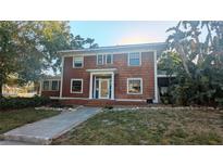 Charming two-story home with mature trees and traditional architecture provides unique curb appeal at 624 19Th W St, Bradenton, FL 34205