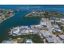 Aerial view of waterfront homes with boat docks on canals leading to the ocean at 444 63Rd St, Holmes Beach, FL 34217