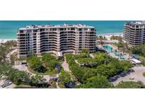 Beautiful high-rise condo with landscaped grounds, a pool, and beach access at 415 L Ambiance Dr # D306, Longboat Key, FL 34228