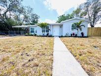 Charming single-story home with a well-manicured lawn and fresh exterior paint at 1142 Newhope Rd, Spring Hill, FL 34606