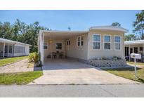 Inviting exterior with covered parking and well-maintained landscaping in a friendly neighborhood at 1307 41St E Ave, Ellenton, FL 34222