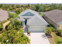 Charming single-story home with a well-manicured lawn and two-car garage at 4529 Golden Gate Cv, Bradenton, FL 34211