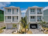 Stunning exterior showcasing modern architecture with a paver driveway and beautiful landscaping at 4206 Saltwater Pearl Way, Cortez, FL 34215