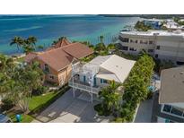 Stunning waterfront home with a rooftop deck offering panoramic ocean views at 113 8Th S St, Bradenton Beach, FL 34217