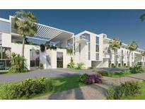 Modern multi-story building with tropical landscaping, covered parking, and a bright white facade at 2170 Robinhood St # A1-304, Sarasota, FL 34231