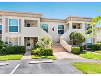 Inviting two-story condo with well-maintained landscaping and convenient parking at 4355 Longmeadow # 23, Sarasota, FL 34235