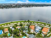 Stunning aerial view of waterfront homes with lush landscaping and bay views in a desirable neighborhood at 829 Bayshore Blvd, Tampa, FL 33606