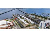 Panoramic aerial view showcases waterfront condos with a bridge and marina access at 150 Harborside Ave # 221, Punta Gorda, FL 33950