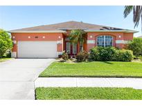 Charming single-story home with a well-manicured lawn, lush landscaping and a two car garage at 4918 Avon Ln, Sarasota, FL 34238