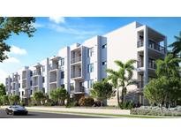 Modern apartment building with balconies and landscaped grounds, offering stylish urban living at 4950 Remington Dr # 304, Sarasota, FL 34234