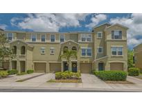 Charming townhouse exterior showcasing well-maintained landscaping and inviting curb appeal at 9008 White Sage Loop # 3605, Lakewood Ranch, FL 34202
