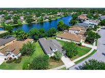 Beautiful waterfront home with lush landscaping and stunning lake views in a desirable community at 14230 Cattle Egret Pl, Lakewood Ranch, FL 34202