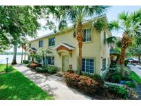 Inviting two-story townhouse featuring well-maintained landscaping and walkway leading to the front door at 3909 45Th W Ter # 102, Bradenton, FL 34210