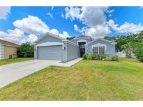 Charming single-story home with a well-maintained lawn, two-car garage, and beautiful landscaping at 4513 Abacos Pl, Bradenton, FL 34203