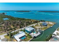 Stunning waterfront home with private dock, pool, and panoramic views of the bay and surrounding islands at 1918 Massachusetts Ave, Englewood, FL 34224