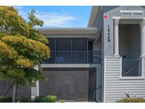Charming two-story condo with screened patios, offering relaxing outdoor living spaces at 12440 Wellen Golf St # 105, Venice, FL 34293