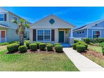 Charming single-story home featuring manicured landscaping, a welcoming front door, and a well-maintained lawn at 4031 Cottage Hill Ave, Parrish, FL 34219