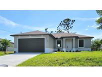 Charming single-story home featuring a well-maintained lawn, gray exterior paint, and a dark brown two-car garage door at 5115 Foxhall Rd, North Port, FL 34288