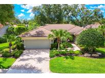 Charming single-story home with lush landscaping, brick driveway, and neutral paint at 4356 Highland Oaks Cir # 3, Sarasota, FL 34235